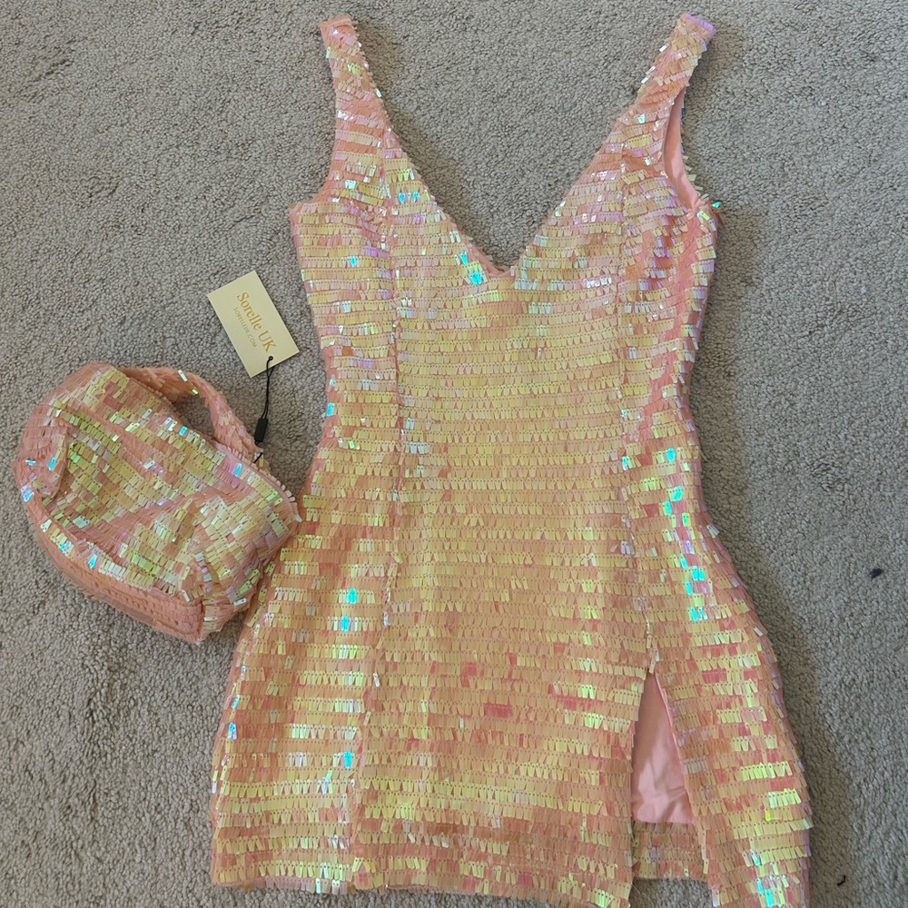 This dress is from SorelleUK! It is a size xs and in the color Peachy.